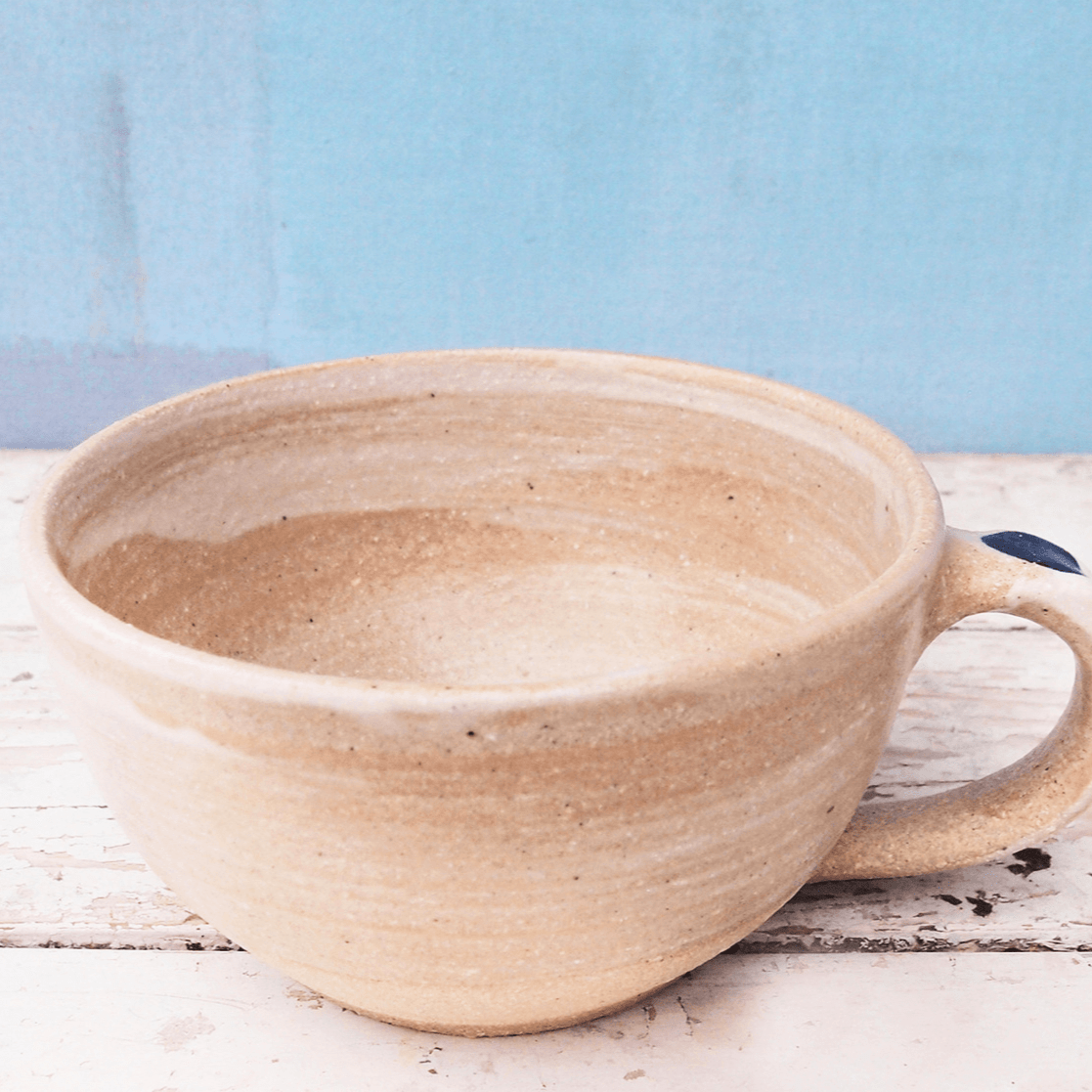 http://sabineschmidt-pottery.com/cdn/shop/files/sabineschmidtpottery-coffee-cup-large-cappuccino-cup-in-white-blue-rustic-studio-pottery-devon-ceramics-32243245514928.png?v=1702840145